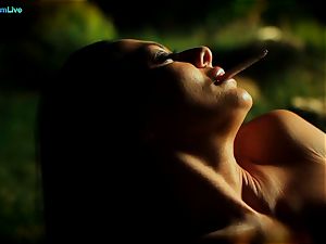 super hot Sandra Romain smokes a ciggy and masturbates